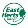 East Herts Council logo featuring the words 'East Herts' in bold green letters, with 'Council' in smaller font below. The text is enclosed within a circular outline, with a stylized map of East Hertfordshire integrated into the design.