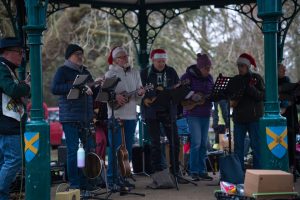 The ukulele band playing under the bandstand in Clarence Park